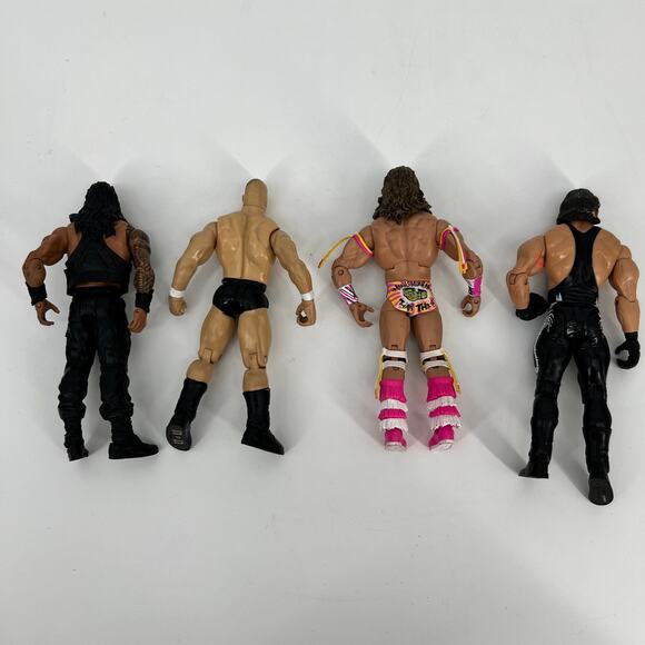 Lot of 4 WWE Action Figures Steve Austin Roman Reigns Ultimate Warrior Sting VTG - Picture 2 of 7